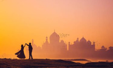 dancing couple in taj mahal sunset