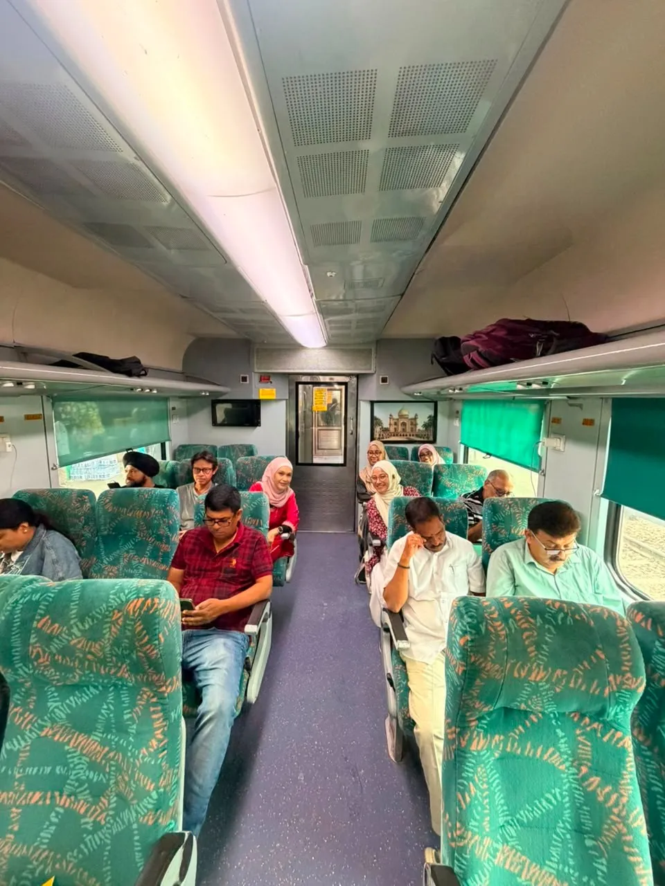 Travellers travelling on the Gatimaan Express during a Same Day Agra Taj Mahal Tour from Delhi