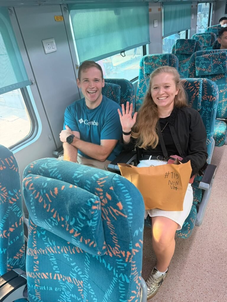 Couple travelling on Gatimaan Express during a Same Day Agra Taj Mahal Tour from Delhi