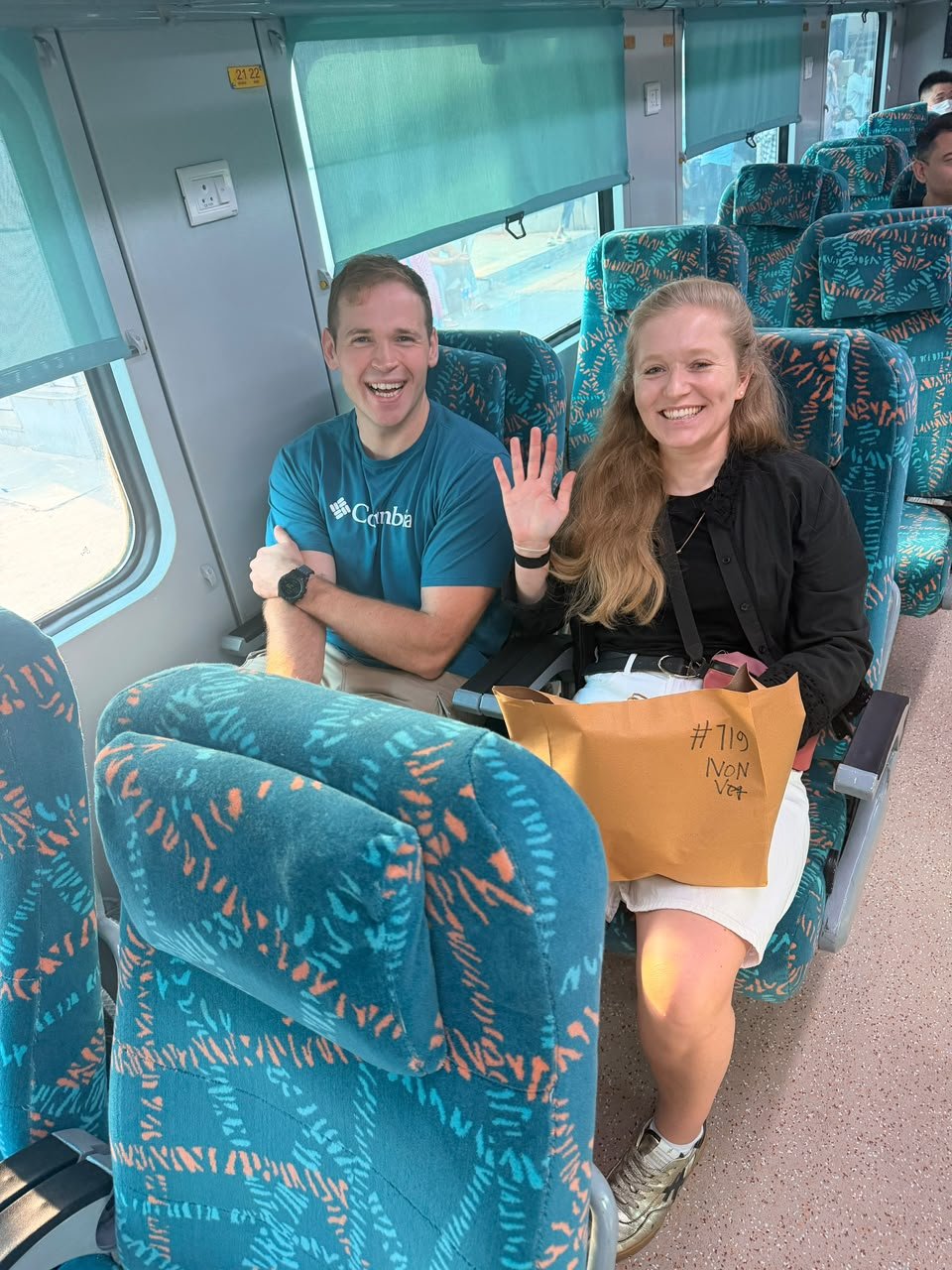 Couple travelling on Gatimaan Express during a Same Day Agra Taj Mahal Tour from Delhi