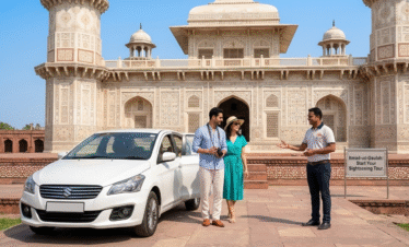 A white sedan parked at the entrance of the Tomb of Itmad-ud-Daulah (the "Baby Taj"). A tour guide in a professional polo shirt is seen welcoming a couple, highlighting the personalized private tour experience.