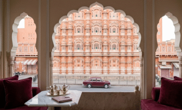 Exclusive balcony view of the Hawa Mahal in the Pink City, highlighting luxury stays near Amer Fort at Jaipur during a private Rajasthan tour.