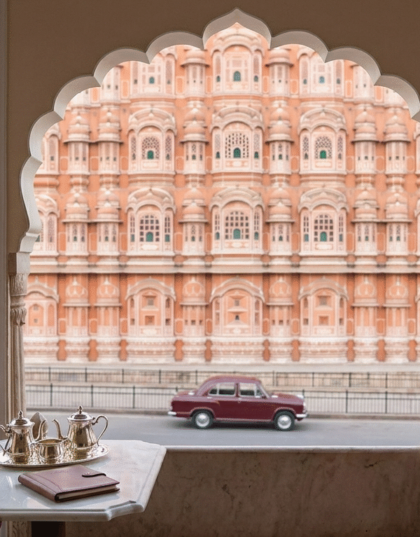 Exclusive balcony view of the Hawa Mahal in the Pink City, highlighting luxury stays near Amer Fort at Jaipur during a private Rajasthan tour.