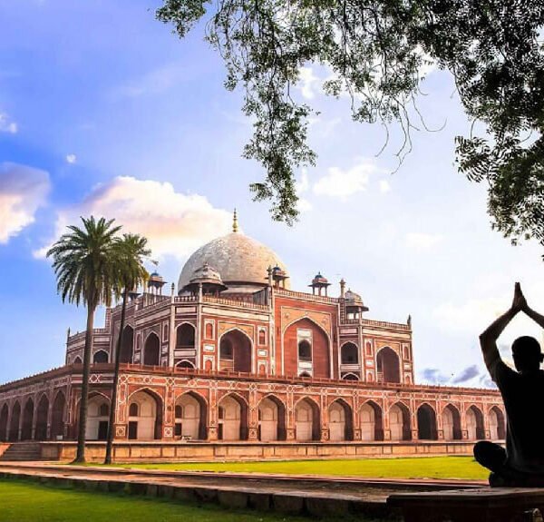 Sunrise view of the Taj Mahal in Agra, a premier destination on the 6-day Golden Triangle Tour India, showing the white marble mausoleum reflecting in the garden fountains.