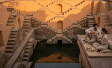 Luxury Rajasthan tours featuring a private sunset sundowner at the geometric Panna Meena Kund in Jaipur.