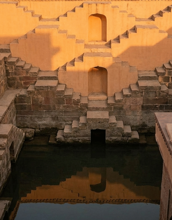 Luxury Rajasthan tours featuring a private sunset sundowner at the geometric Panna Meena Kund in Jaipur.