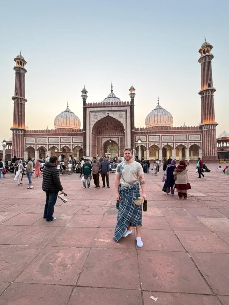 Trip Search Result 7 Tourists posing in the courtyard of Jama Masjid during a Same Day Delhi Tour By Car