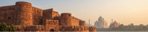 A premium Agra Fort tour showing the red sandstone architecture of the Lal Kila Agra during sunset.