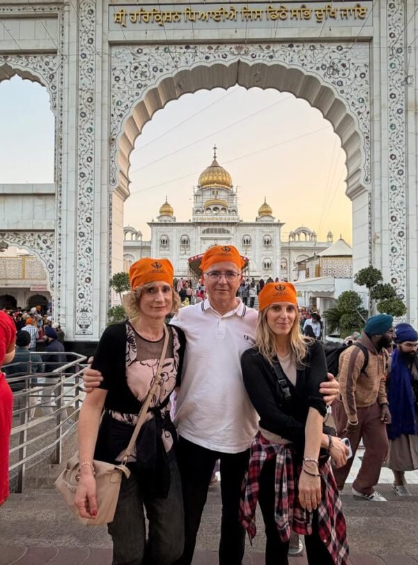 Delhi Temples and Spiritual Sites Tour visitors at Gurudwara Bangla Sahib experiencing Sikh heritage and spiritual culture in Delhi
