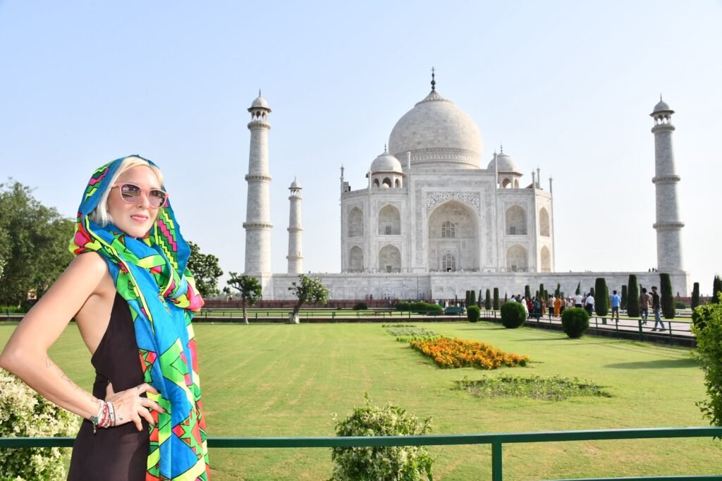 Tourist visiting the Taj Mahal in Agra during a luxury India tour