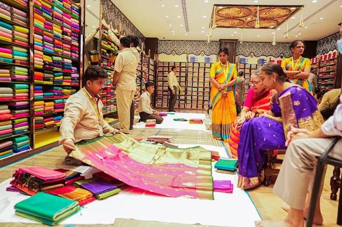 Customers shopping for authentic Banarasi silk sarees, one of the best gifts from India.