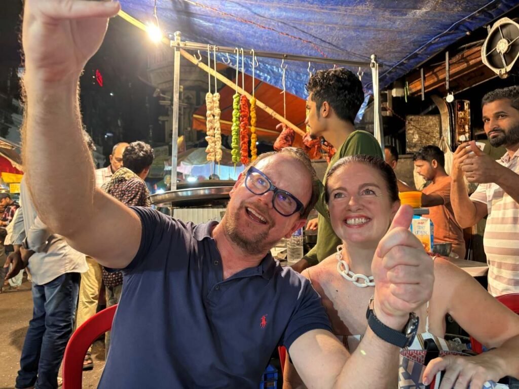 From Chandni Chowk to Dharavi, travelers enjoying authentic Mumbai street food during a guided food tour.
