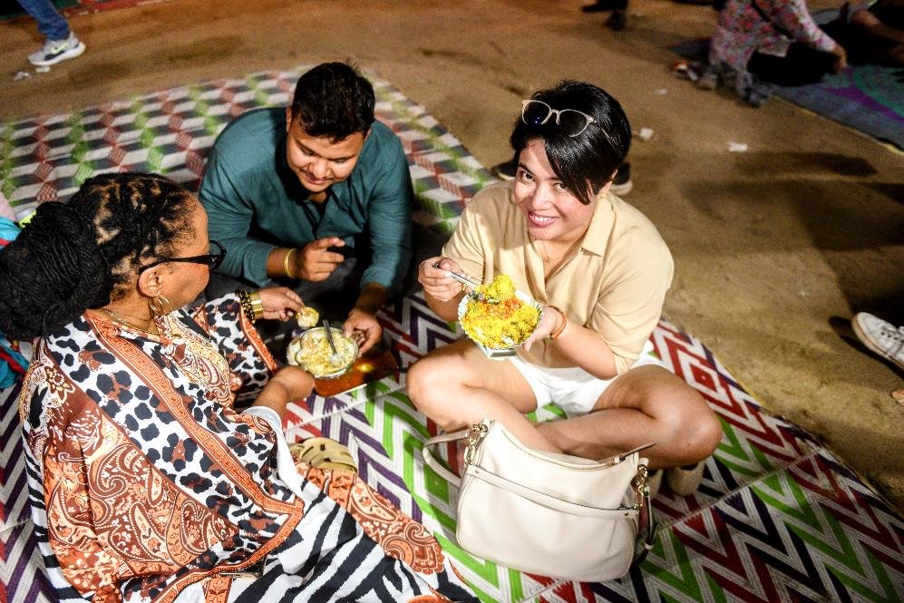 From Chandni Chowk to Dharavi, travelers enjoying authentic Mumbai street food during a guided food tour.