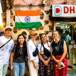 From Chandni Chowk to Dharavi, travelers exploring Dharavi in Mumbai with a local guide during a cultural walking tour.