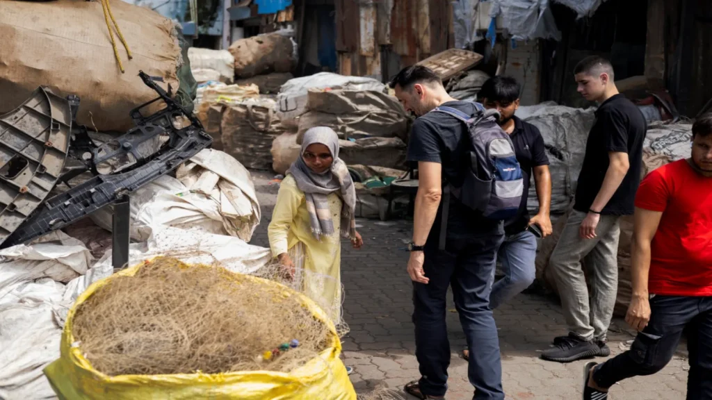 From Chandni Chowk to Dharavi, travelers exploring the recycling industry in Dharavi during a guided walking tour in Mumbai.