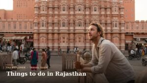 Traveler enjoying chai in front of Hawa Mahal, one of the top things to do in Rajasthan, Jaipur