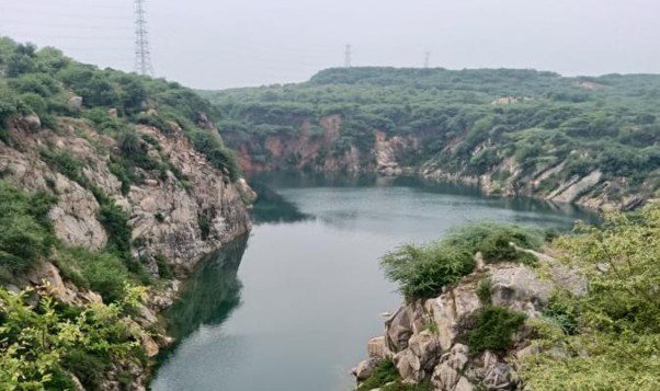 15 Best Parks in Delhi for Nature, Morning Walks and Sightseeing 16 Parks in Delhi featuring the rocky hills, natural lake and green vegetation of Asola Bhatti Wildlife Sanctuary
