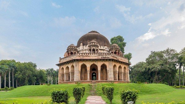 15 Best Parks in Delhi for Nature, Morning Walks and Sightseeing 2 Parks in Delhi featuring a historic red and white domed tomb surrounded by green lawns and trees